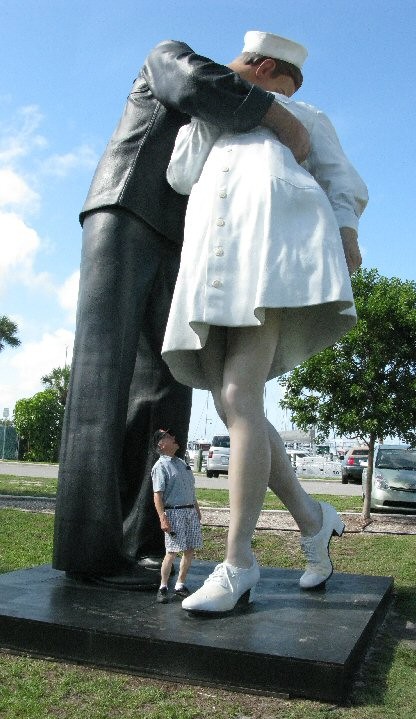 This giant and ugly statue is art.  My dad looking up the statue nurse's skirt?  Now that's entertainment!